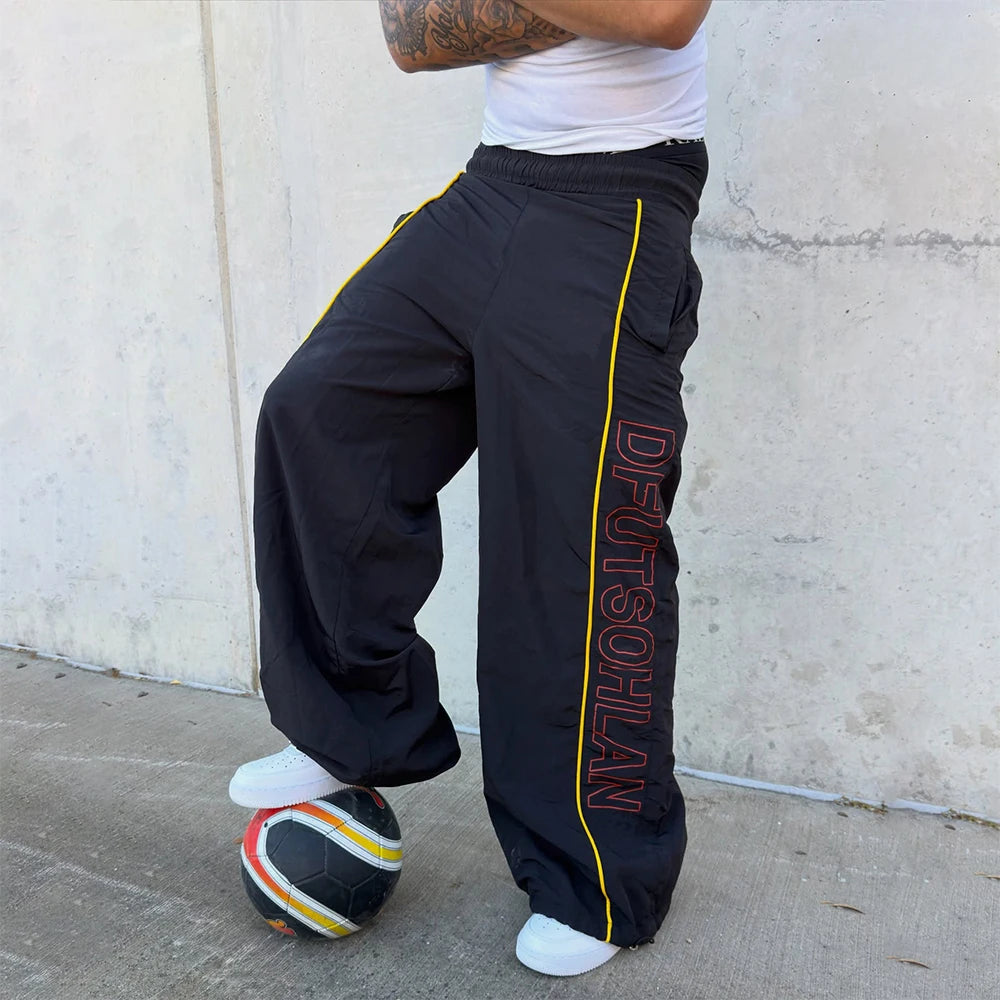 Custom Men's Baggy Stacked Windbreaker Pants Sweatpants for Men Nylon Spandex Track Pants Manufacturer